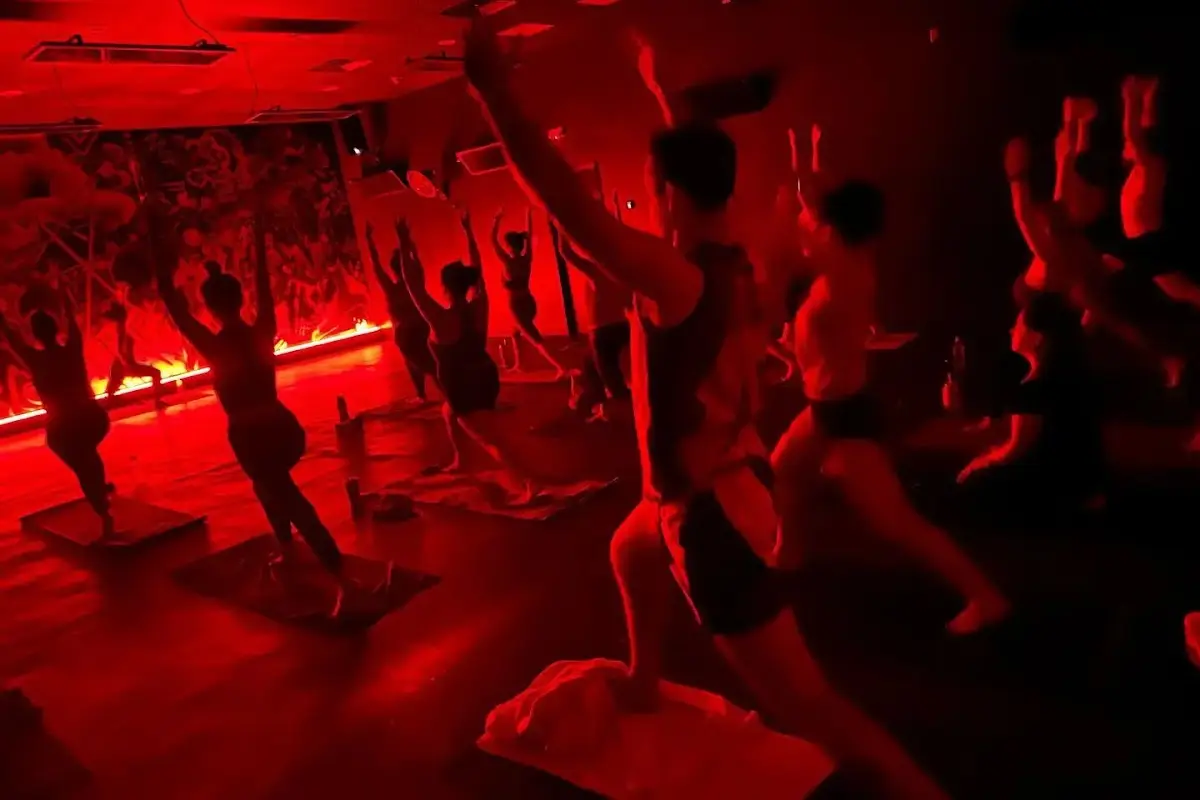 Fire Flow Hot Yoga in New Orleans, which is a studio that specializes in upbeat yoga classes in a dark room