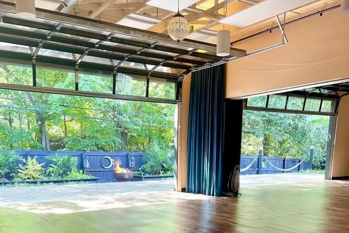 The outdoor yoga space at Khali Yoga Center, with an abundance of plants