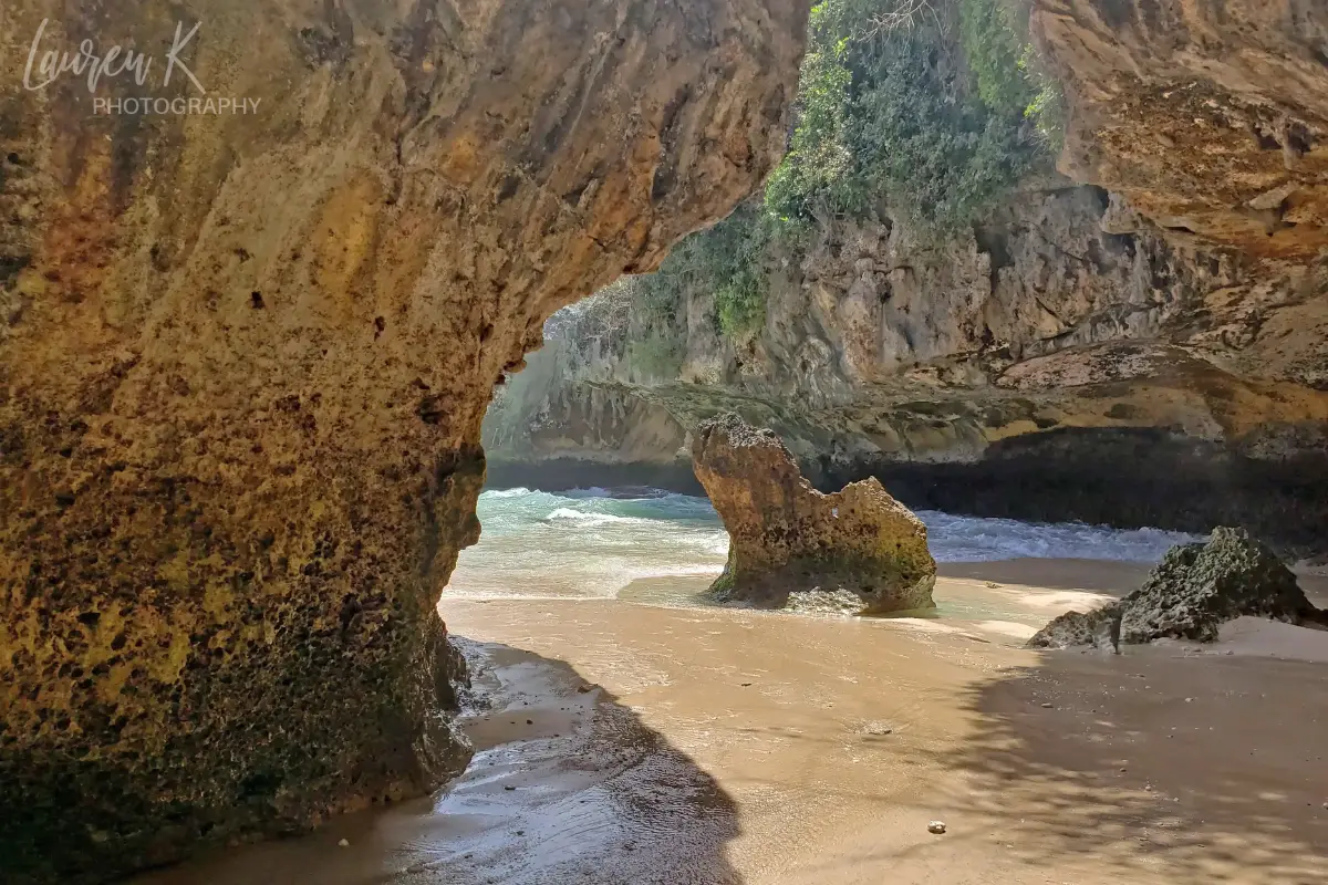 The limestone caves and rock formations at an empty Suluban Beach, with the tide rising