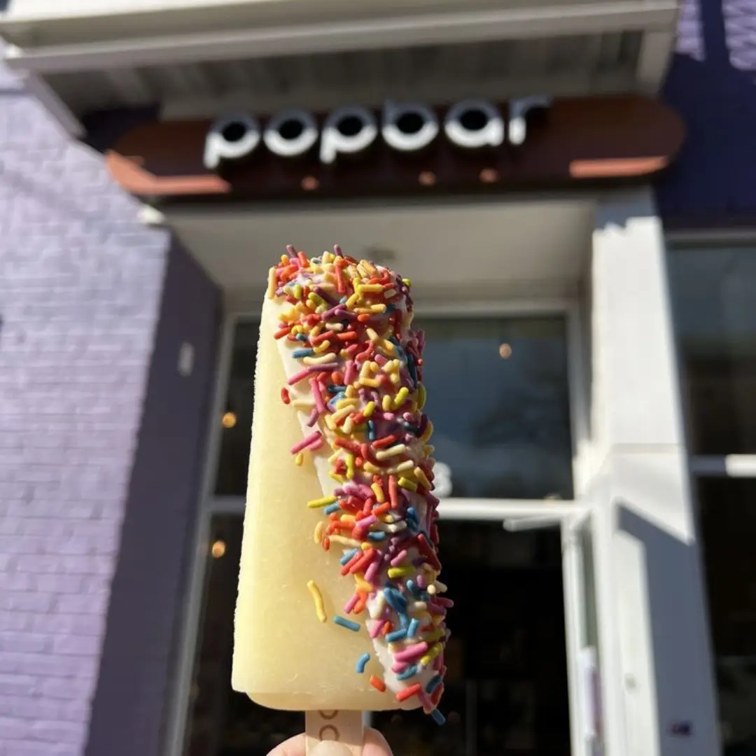 Popbar gourmet popsicle with sprinkles out front of their store location in NODA Charlotte