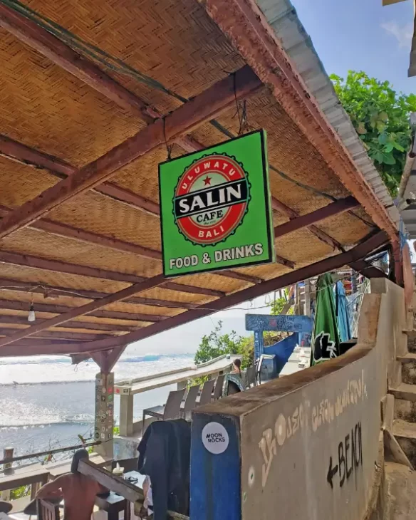 The sign at the Salin Warung which is a place for food and drinks at Suluban Beach on the cliffs