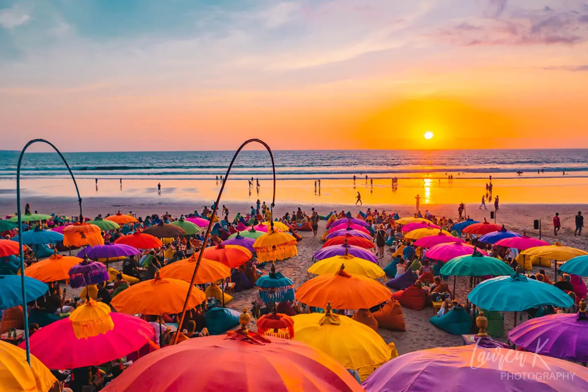Bali sunset in Seminyak with colorful beach umbrellas