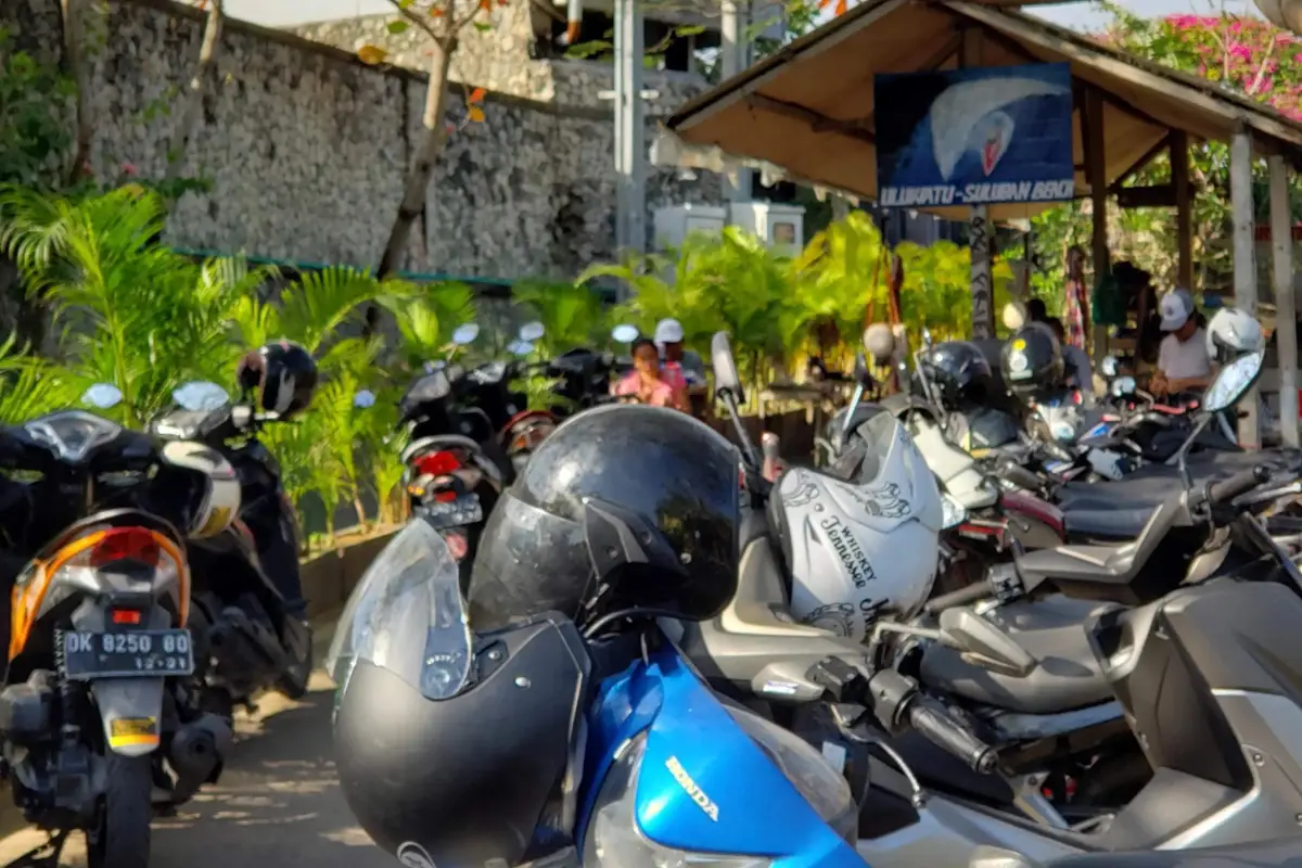 Suluban Beach parking lot in Uluwati Bali, with scooters parked