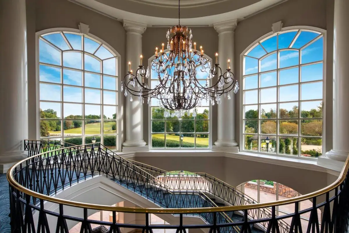 The beautiful atrium and staircase at the Ballantyne Resort, which is one of the most romantic places to stay in Charlotte