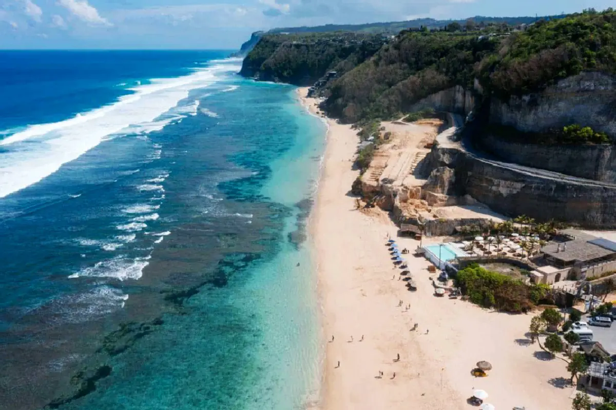 Aerial view of Melasti Beach in Bali, which is one of Uluwat's most popular beaches with beach clubs and amazing views