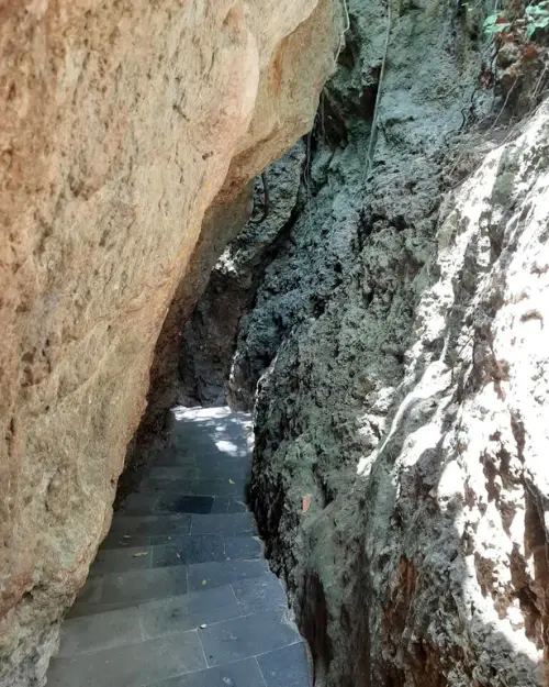 Cave steps that lead to Padang Padang beach in Uluwatu Bali