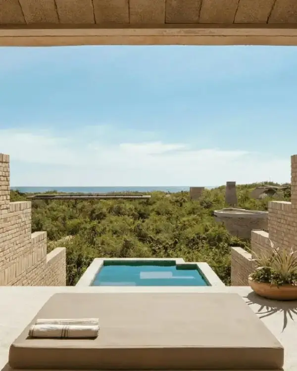 Private pool suite at Hotel Terrestre, looking out over the trees and ocean in the distance, to visually show one of the best choices for couples for where to stay in Puerto Escondido