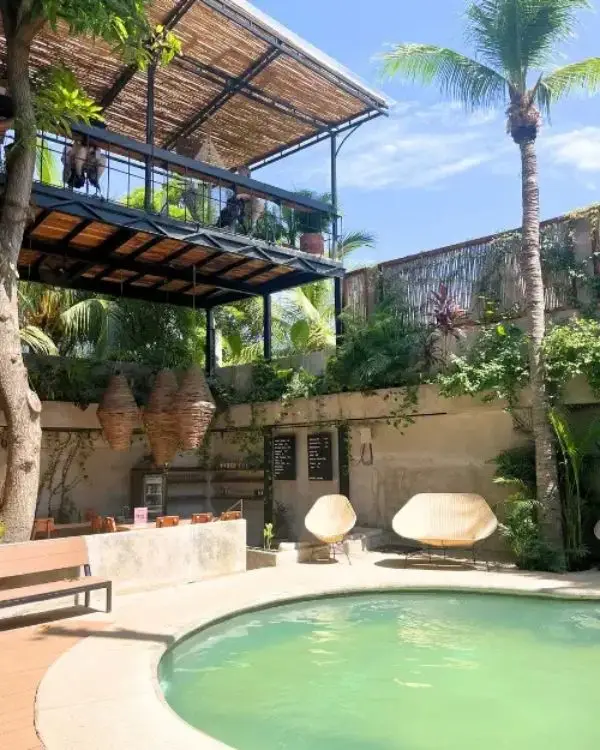 Pool and coworking space at Nectar in La Punta on a sunny day, showing that it's one of the best spots for where to stay in Puerto Escondido Mexico for digital nomads
