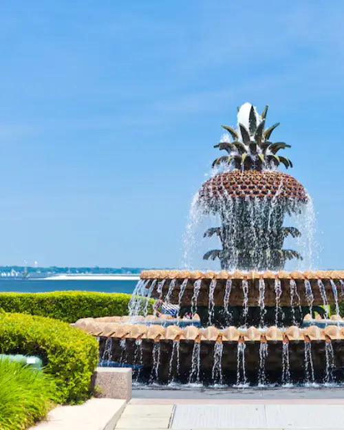 An up close photo of the Charleston pineapple fountain on a cloudless day