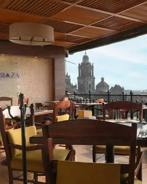 The terrace restaurant at Gran Hotel Ciudad de México with a view of the historical buildings of the city