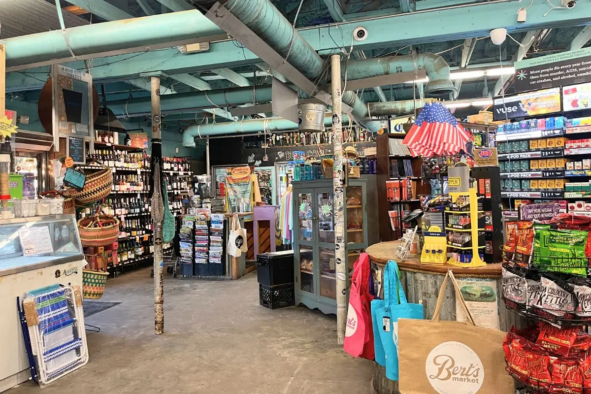 Bert's Market interior showing a shelf of wine and conveniences