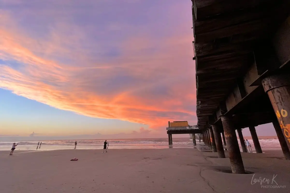 Charleston SC beaches cover image which shows the Folly Beach pier during a beautiful sunrise