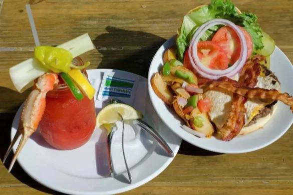 A spread of a breakfast sandwich and bloody Mary at Crab Shack