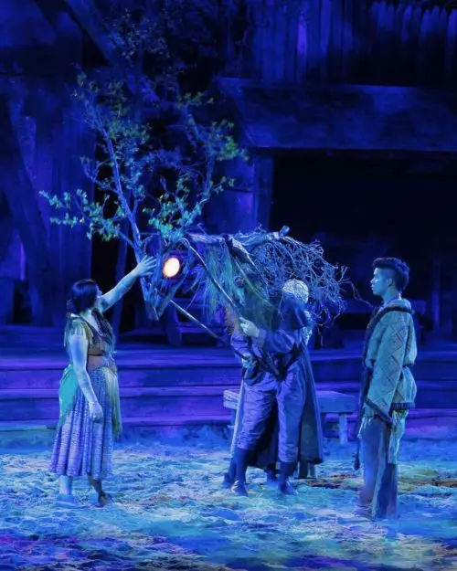 A lit up giant horse puppet and blue lighting used as special effects in the Lost Colony show on stage