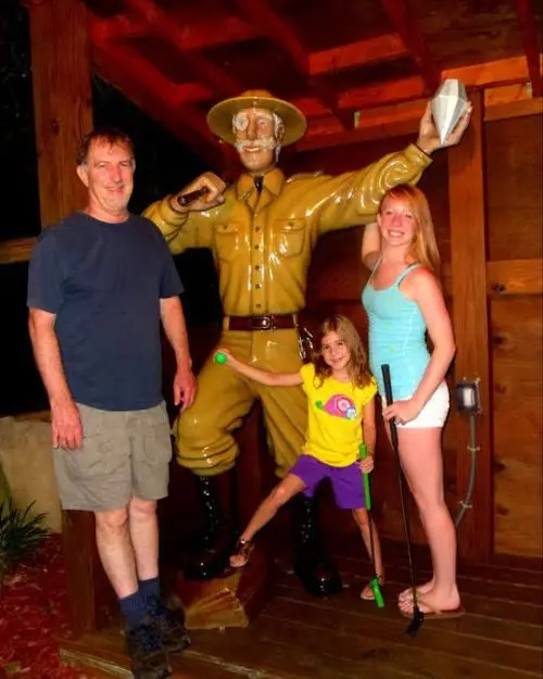 Me, my dad and sister in front of the photo op spot at the Lost Treasure Mini Golf