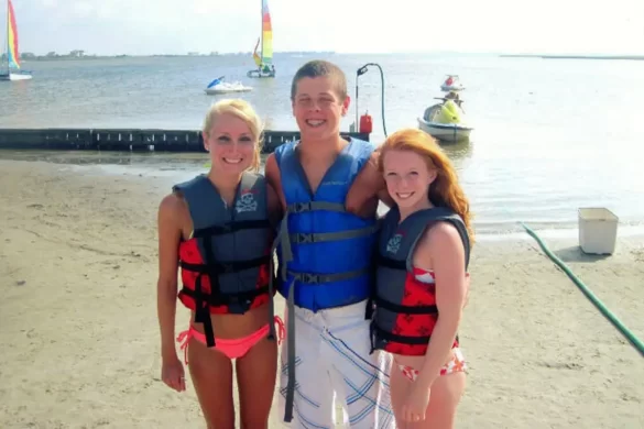 My best friend, her male cousin and me with life jackets on about to jet ski, which is one of the best things to do in Outer Banks on the water on a nice day
