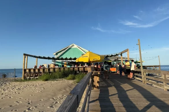 Fish Heads, which is an inviting, iconic and local favorite pier + restaurant with live music, on a sunny day