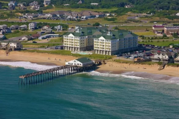 An aerial view of the Hilton Garden Inn, one of the best hotels for where to stay in Outer Banks, showing that it has its own pier 