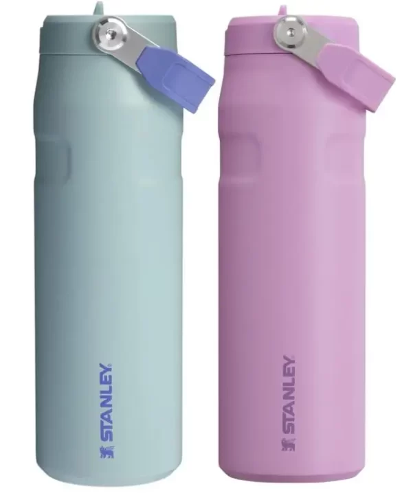 Two Stanley water bottles with handles and straws that flip in and out, making it one of the most useful and unique gifts for travel lovers that can be chosen in any color