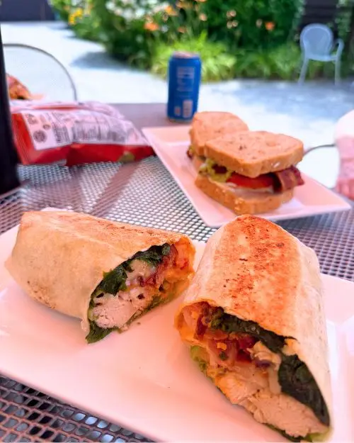 The yummy Chipotle chicken wrap on a shaded table