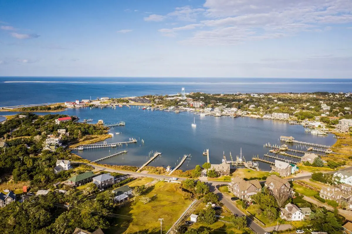 An aerial view of the beautiful town of Okracoke on the water, one of the top choices for where to stay in Outer Banks NC for a romantic or quaint getaway