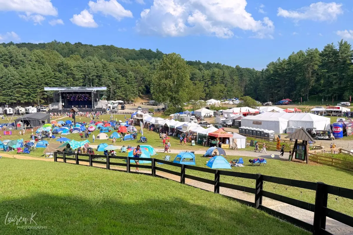 Floydfest Review cover image, showing an overview of the main stage under a sunny sky
