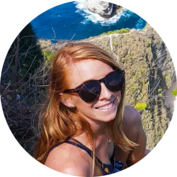 Headshot of Lauren Kessel, the author of Inspired Backpacker blog, while hiking