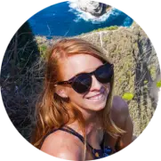 Headshot of Lauren Kessel, the author of Inspired Backpacker blog, while hiking