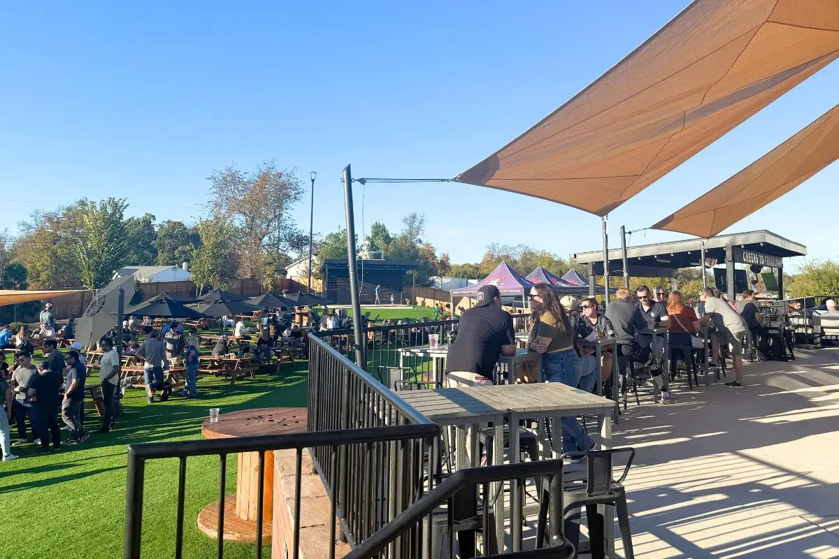 The outdoor patio at Honor Brewing Company Loudoun on a sunny day with lots of people