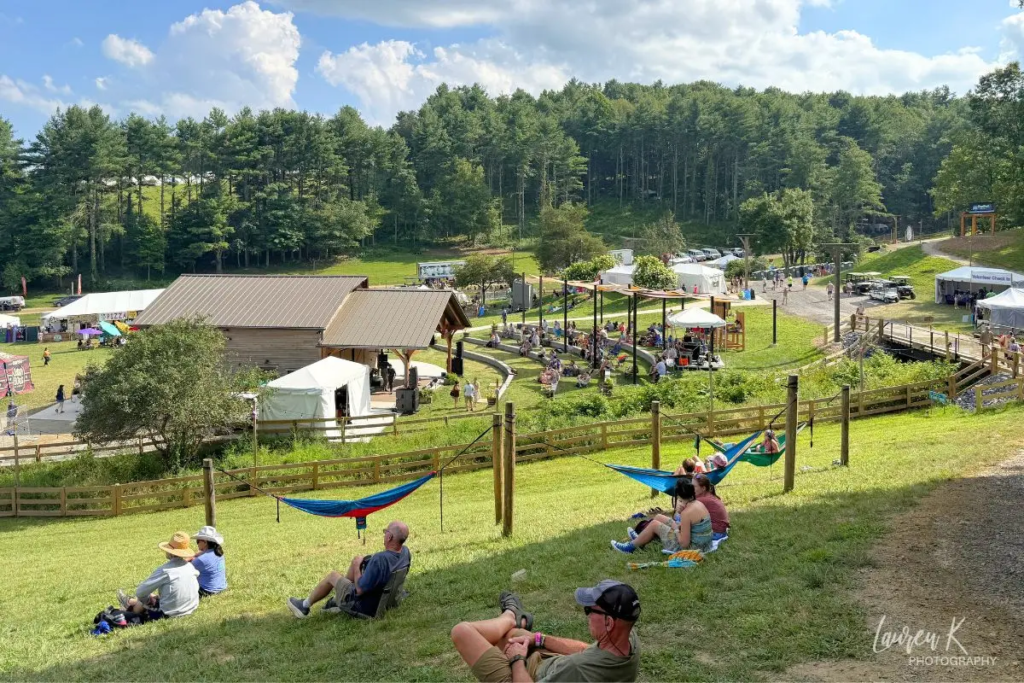 Floydfest review cover image which shows one of the stages on a sunny day with plenty of green space
