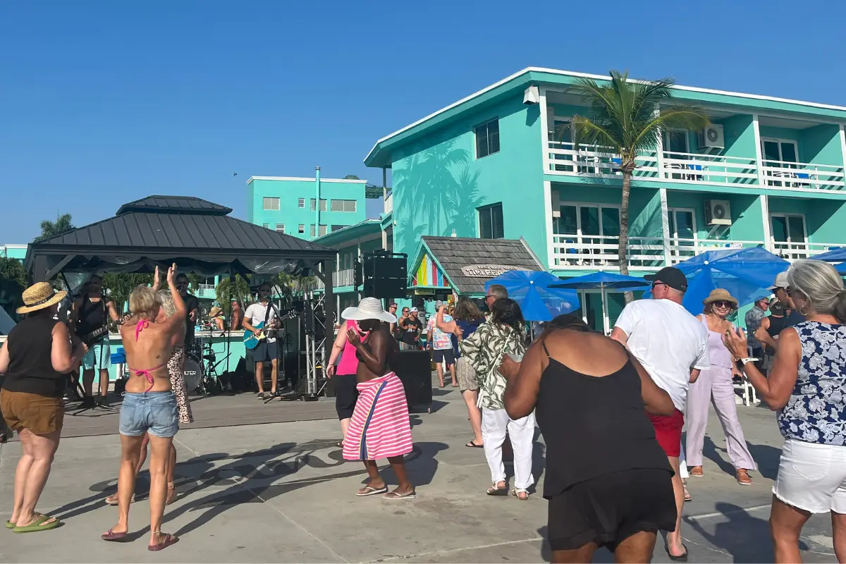 People dancing at Ikki Woo Woo's Tiki Beach Bar which offers live music St Pete Beach 