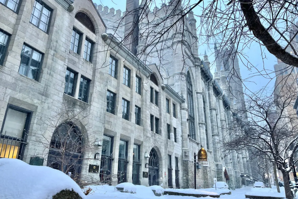 Cover image for the one day in Montreal blog which shows one of the historic buildings in the city on a snowy day