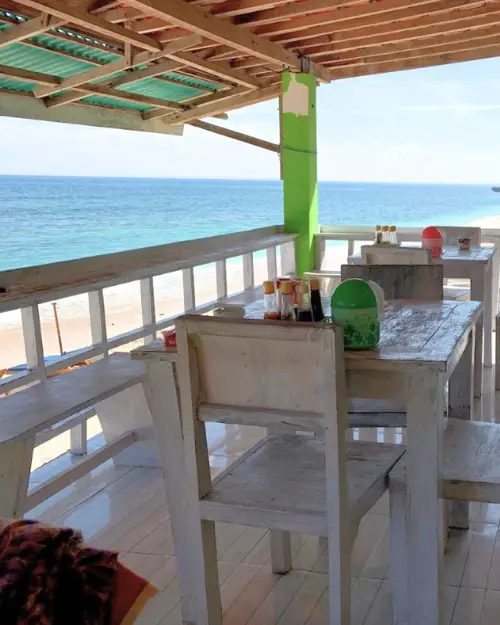 Open air eatery with a roof on a cliff overlooking the ocean